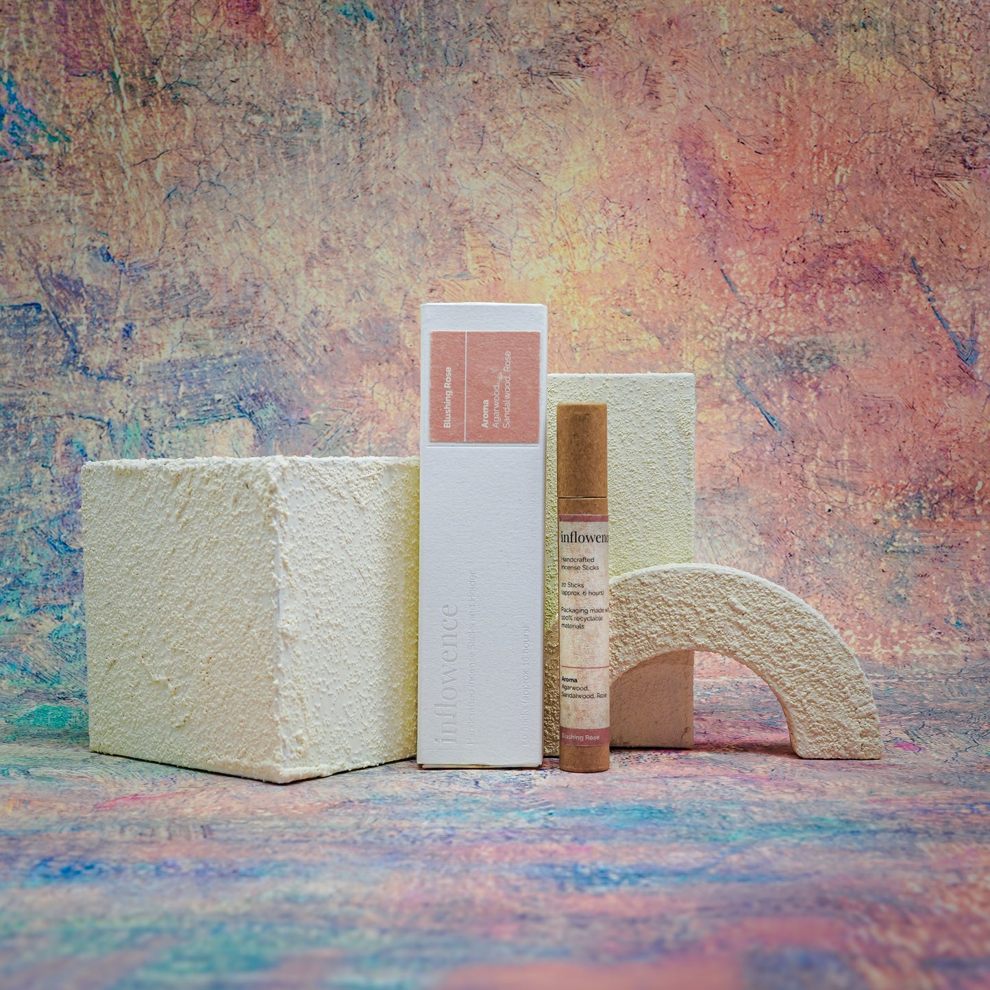 Blushing Rose box and tube incense set displayed with a white textured block decoration, set against a Claude Monet–inspired canvas — a dreamy, floral scene evoking soft beauty and ritual calm.
