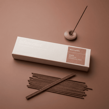 Rose incense sticks named ‘blushing rose’ packed in an incense box labeled 'inflowence' on a red background