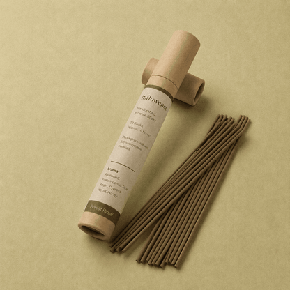 Frankincense incense sticks named ‘forest ritual’ packed in an incense kraft paper tube labeled 'inflowence' on a green background