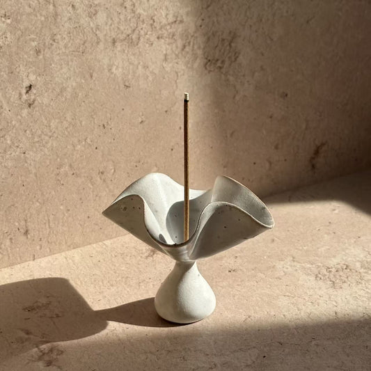 Ceramic petal incense holder with sculptural flower form, designed to hold incense sticks for modern ritual and mindful living
