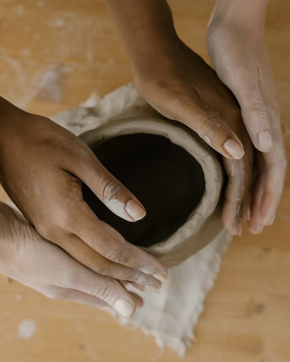 Hands shaping high-fired clay during the making of a heat-resistant ceramic incense holder, highlighting strength, stability, and safe incense burning