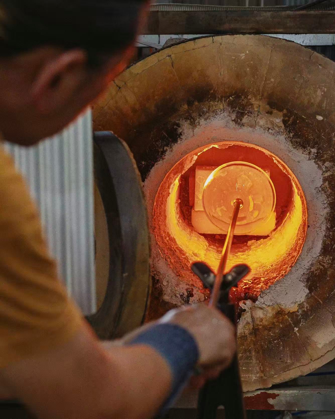 Molten glass being heated in a furnace during the making of a heat-resistant glass incense holder, highlighting durability and safe incense burning