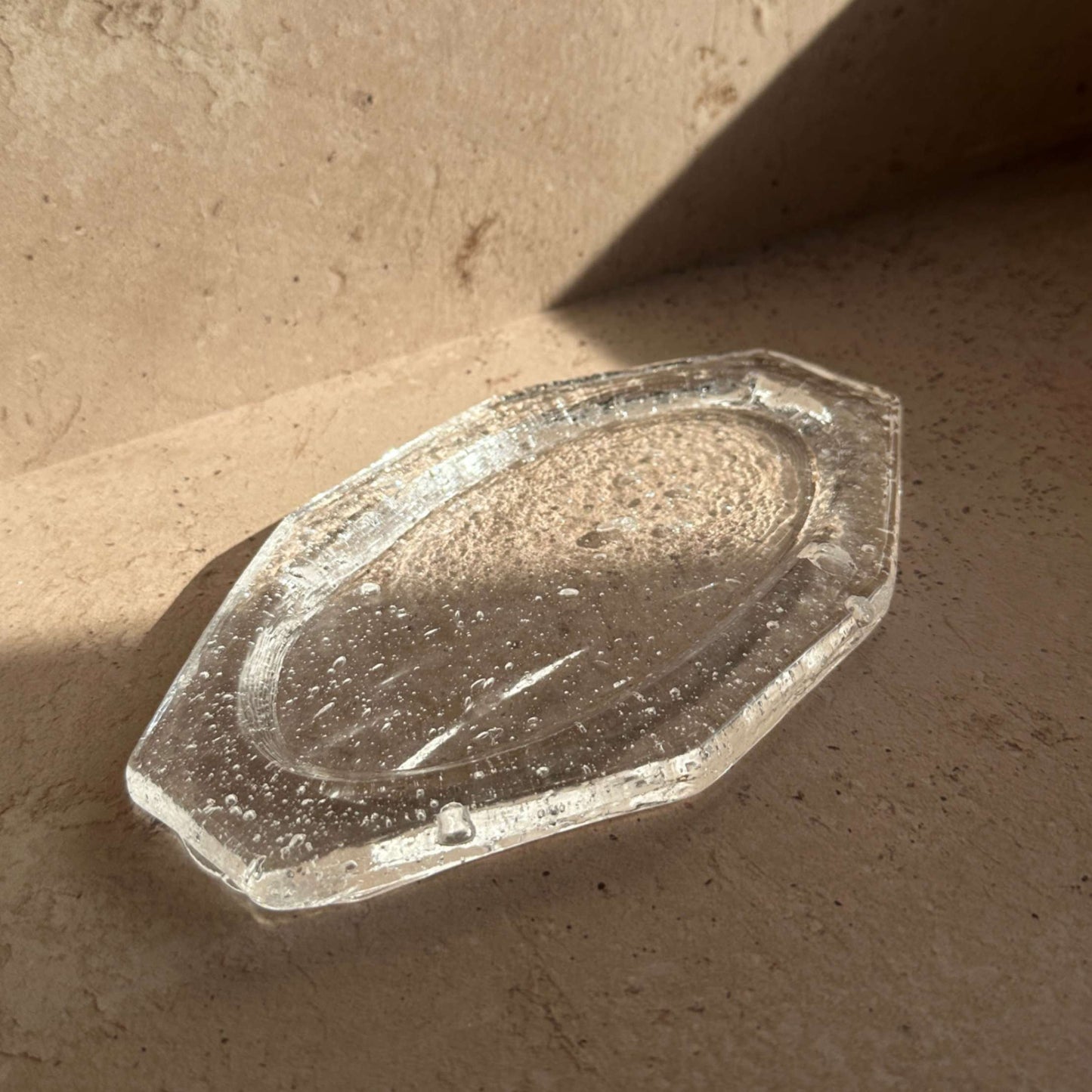 Handcrafted glass ash catcher with a minimalist, sculptural form designed to collect incense ash