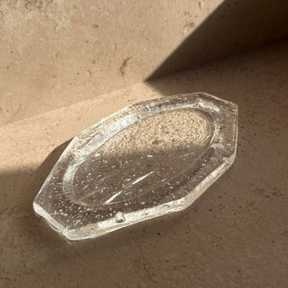 Handcrafted glass ash catcher with a minimalist, sculptural form designed to collect incense ash