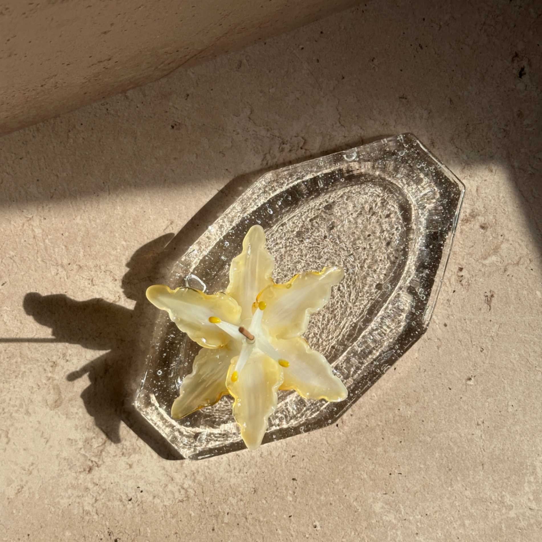 Handcrafted glass ash catcher designed to catch falling incense ash, featuring a sculptural floral form