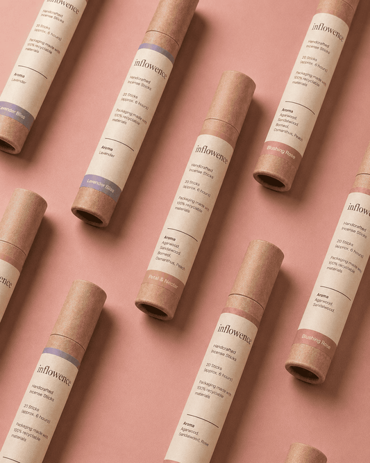 Three different incense named 'lavender bliss', 'petal & nectar', 'blushing rose', labeled with 'inflowence' on the paper kraft tube in different color backgrounds.