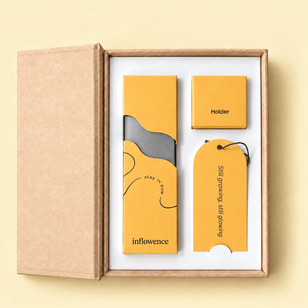 Inside the Petal & Nectar box by Inflowence: 75 charcoal-free incense sticks, a boxed incense holder and a bookmark reading “Still growing, still glowing.”