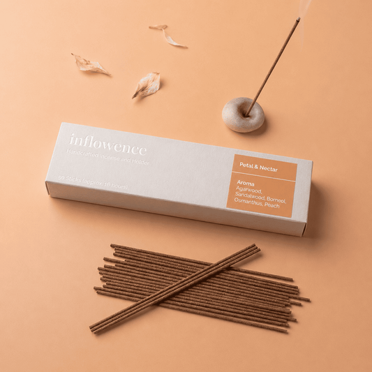 Flower incense sticks named ‘petal & Nectar’ packed in an incense box labeled 'inflowence' on a orange background