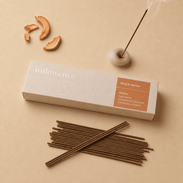 Flower incense sticks named ‘petal & Nectar’ packed in an incense box labeled 'inflowence' on a orange background