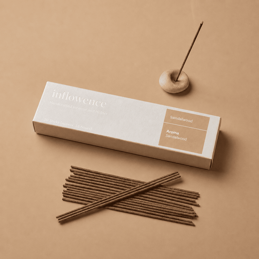 Sandalwood incense sticks named ‘sandalwood’ packed in an incense box labeled 'inflowence' on a beige background