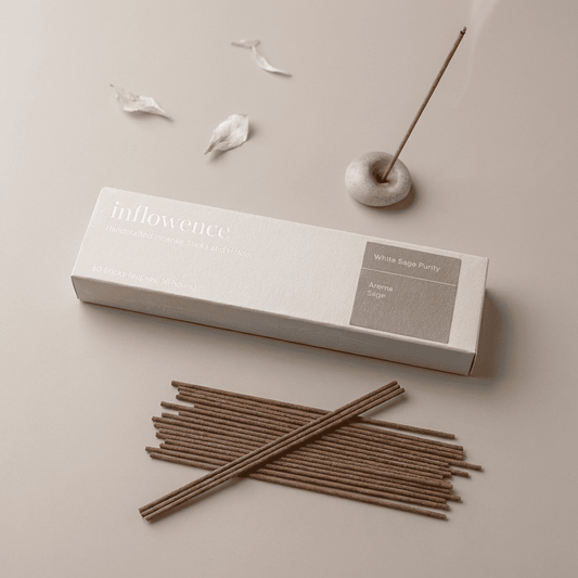 White sage incense sticks named ‘white sage purity’ packed in an incense box labeled 'inflowence' on a beige background