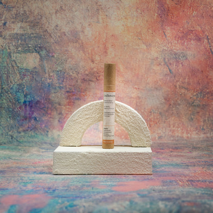 Petal & Nectar incense tube displayed with white textured decor in front of a Claude Monet–inspired canvas — a serene, romantic composition that highlights the gentle elegance of the scent.