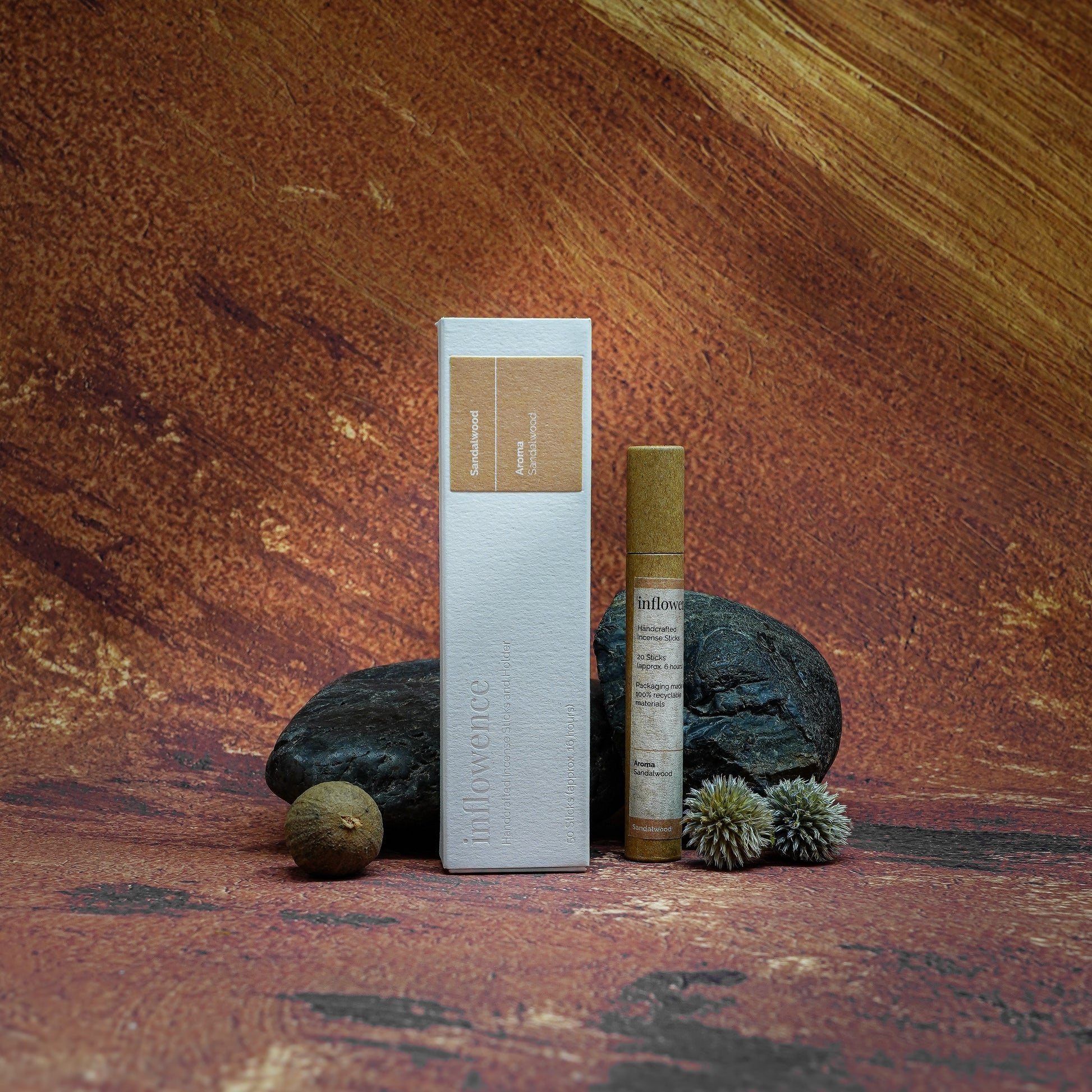 Sandalwood incense box and tube set displayed in front of a Grand Canyon-inspired oil painting backdrop, symbolizing spiritual cleansing and energy renewal with natural serenity and earthy calm.