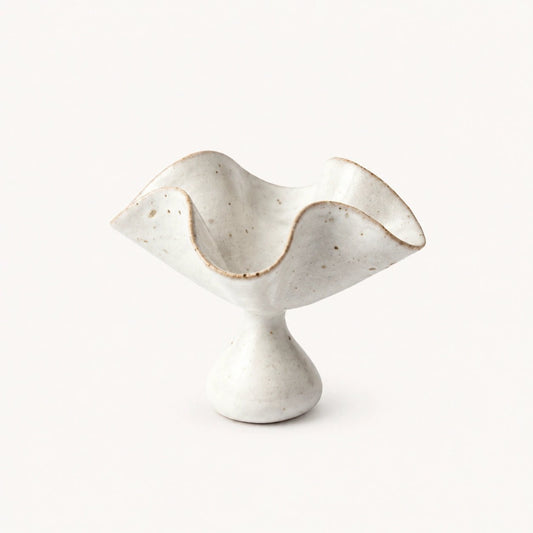 Ceramic Petal Incense Holder by Inflowence, hand-formed in speckled white glazed ceramic with a wavy petal-shaped dish on a rounded pedestal base.